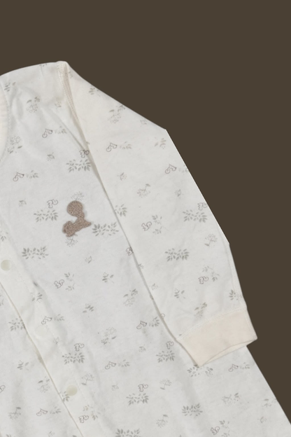 Ivory Forest Short Romper - Side view showing snap closure and floral print