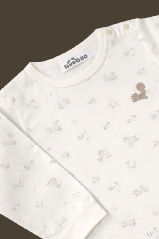 Ivory Forest Short Romper - Close-up of neckline label and floral print detail