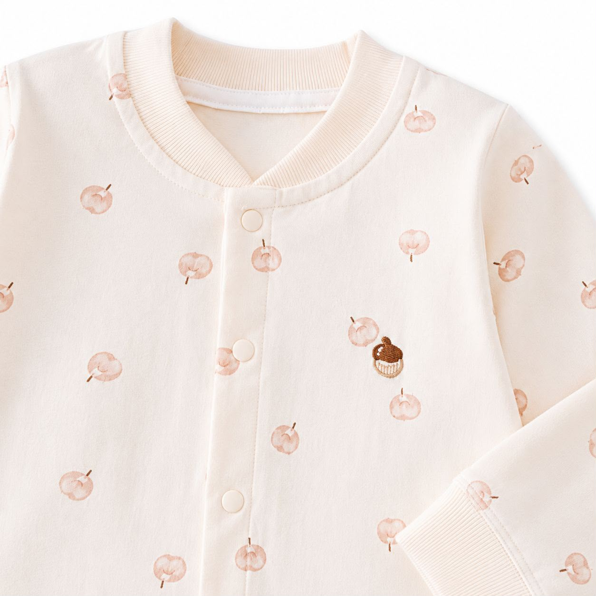 Sweet Peach Baby Romper - Upper body close-up showing apple print and snap buttons