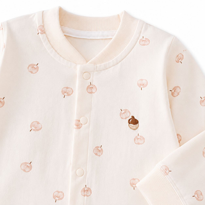 Sweet Peach Baby Romper - Upper body close-up showing apple print and snap buttons